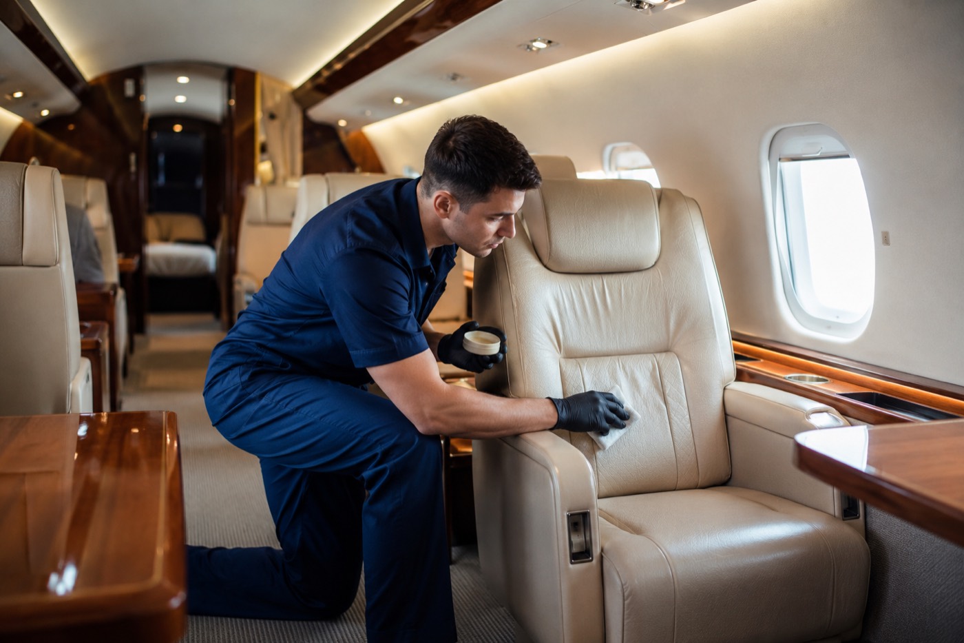 Private jet cabin interior detailing with leather conditioning